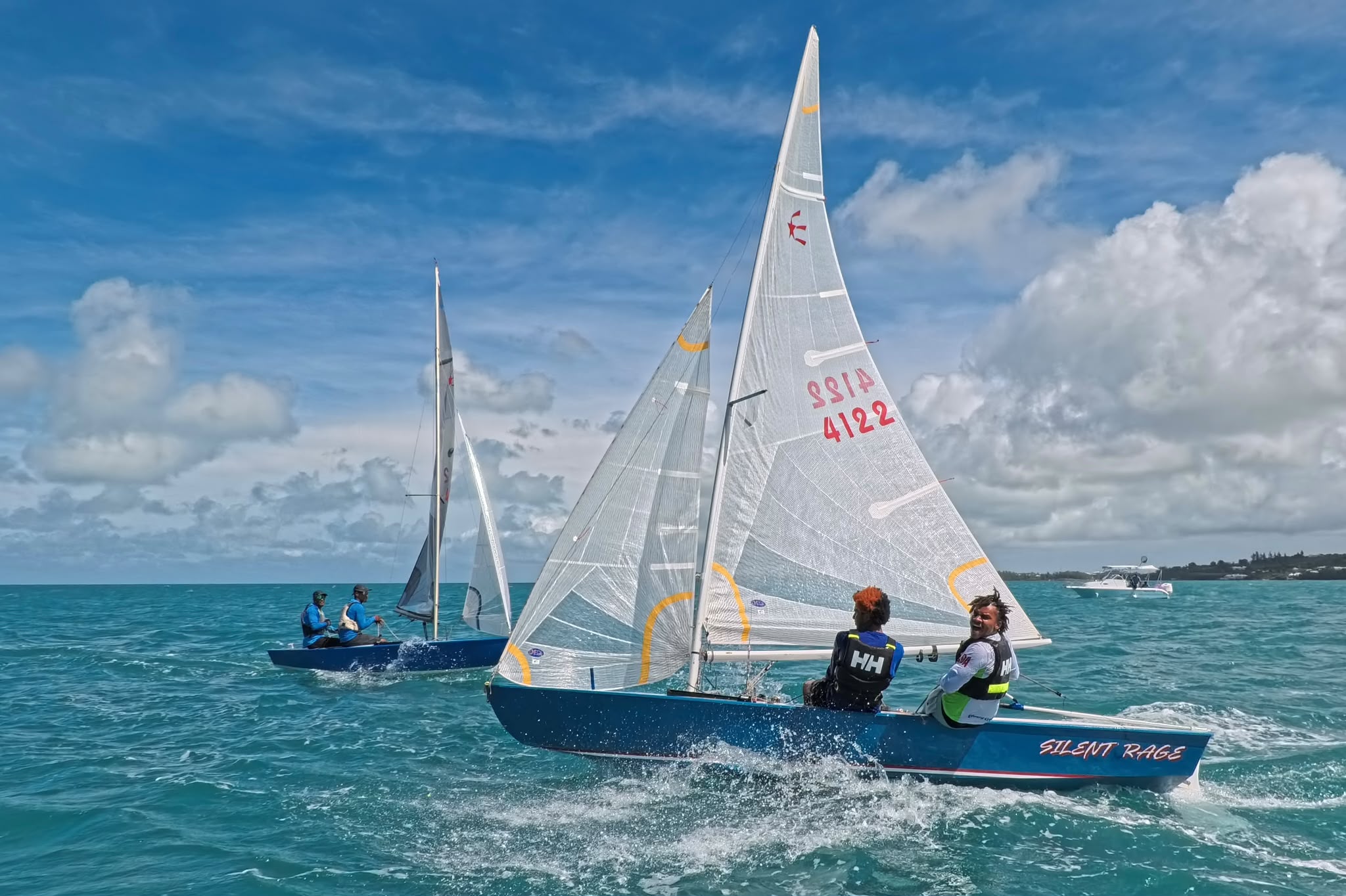 Smiling young sailors racing on Bermuda's open water